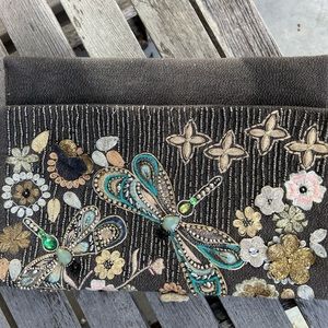 Embroidered clutch